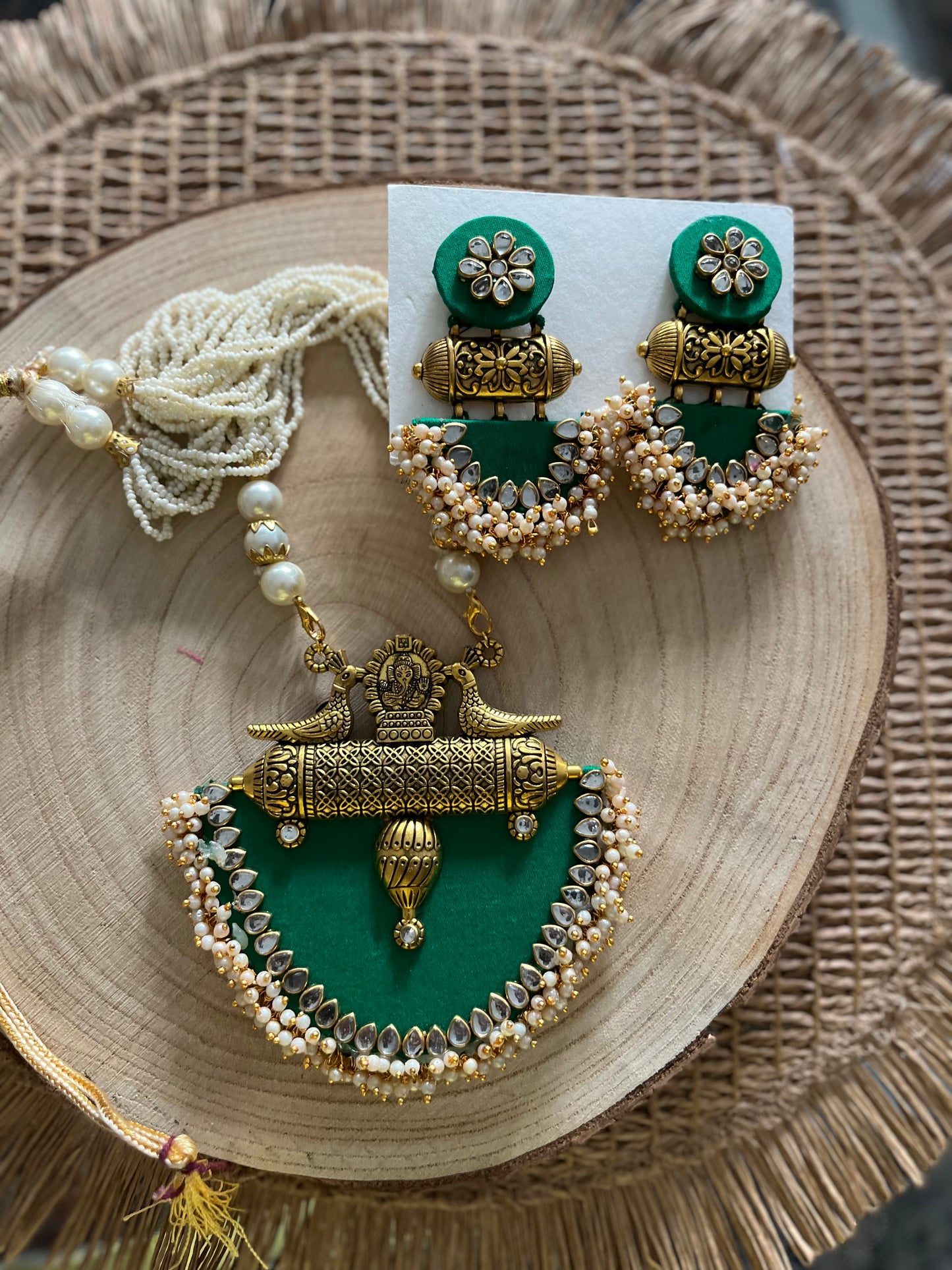 Long fabric necklace completed with faux beads and matching earrings - green