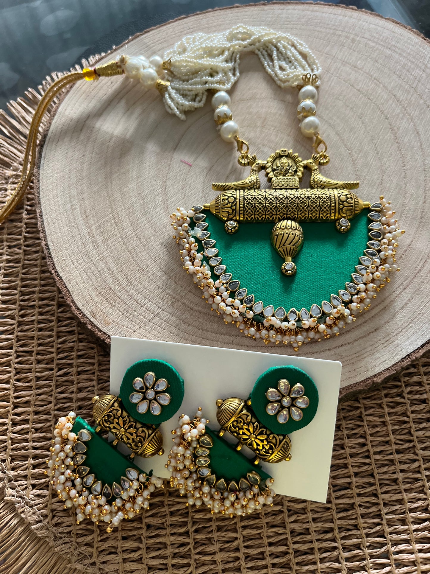 Long fabric necklace completed with faux beads and matching earrings - green