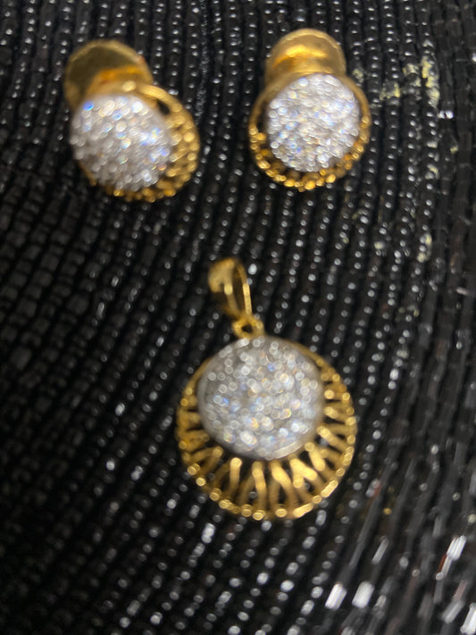 Sun shape pendent set with faux stones and matching earrings