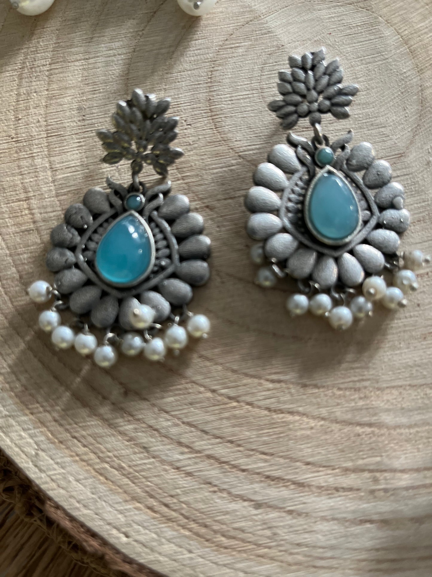 Oxidised antique earrings in intense flower