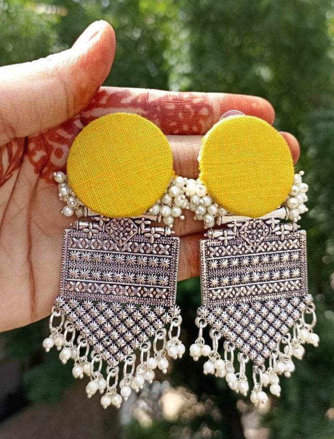 Fabric earring with oxidized dangle