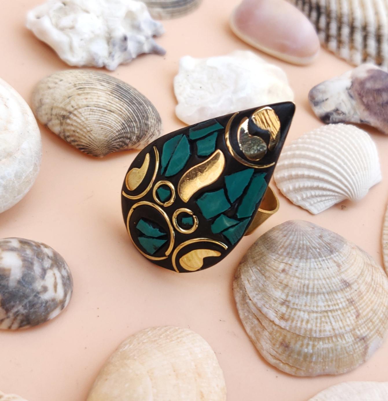 Tribal drop ring in green and golden