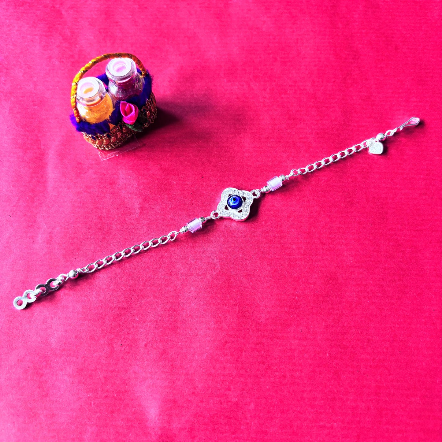 Rakhi- Silver rakhi with evil eye