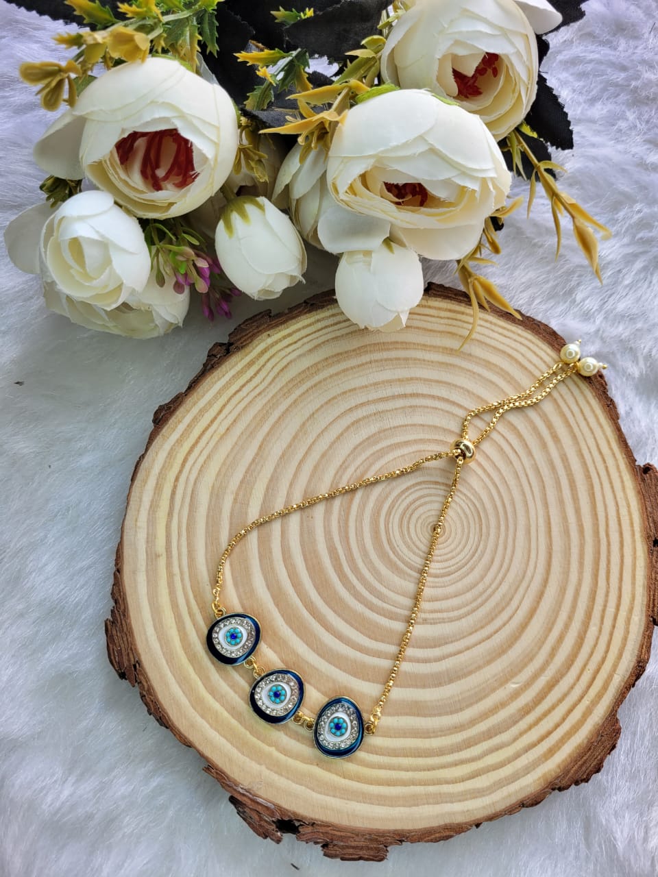 Triple-Blue-Eye Bracelet with Golden colour Chain
