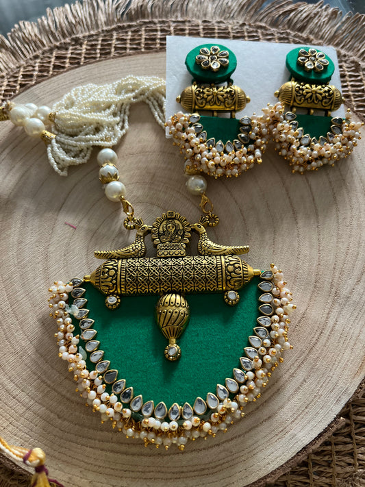 Long fabric necklace completed with faux beads and matching earrings - green