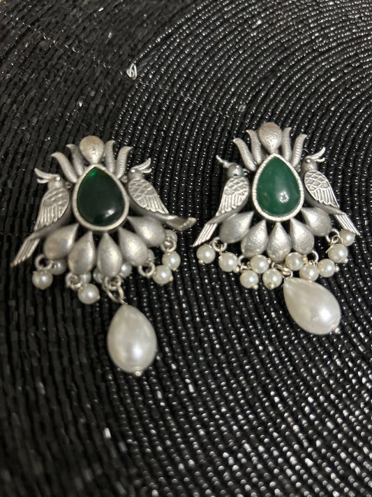 Oxidised antique earrings with green parrot
