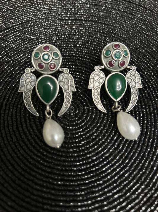 Oxidised antique earrings with green peacock