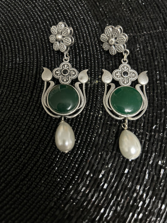 Oxidised antique earrings with green big faux stone