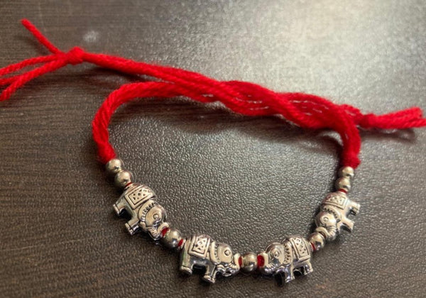 Rakhi - handmade, elephant beads, silver colour