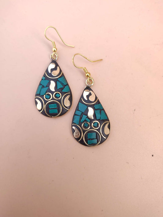 Tribal earring in tear drop shape, with golden rising flame