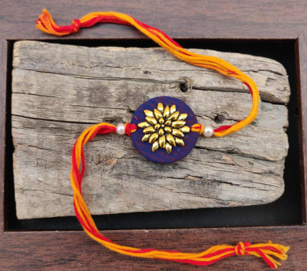 Rakhi - handmade, fabric and meenakari work, round shaped, blue colour