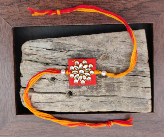 Rakhi - handmade, fabric and meenakari work, square shaped, red colour