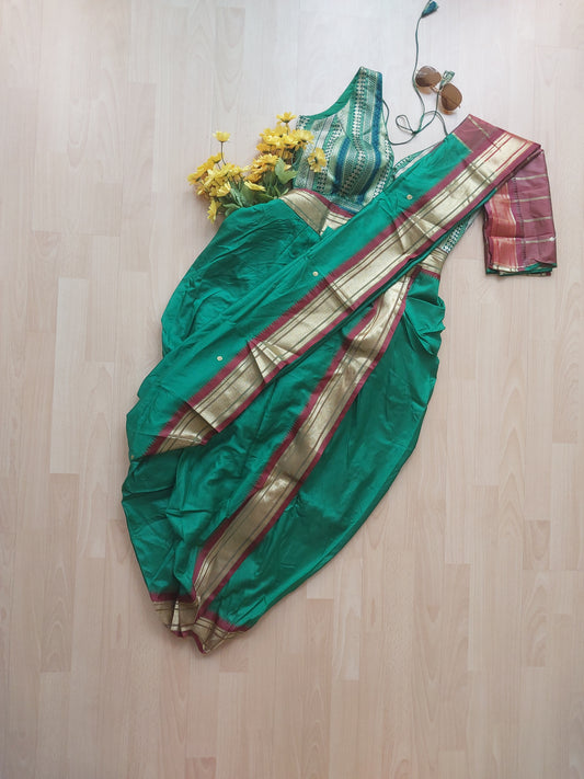Dark green coloured 9 yards, Nauvari stitched saree (Buy or Rent)