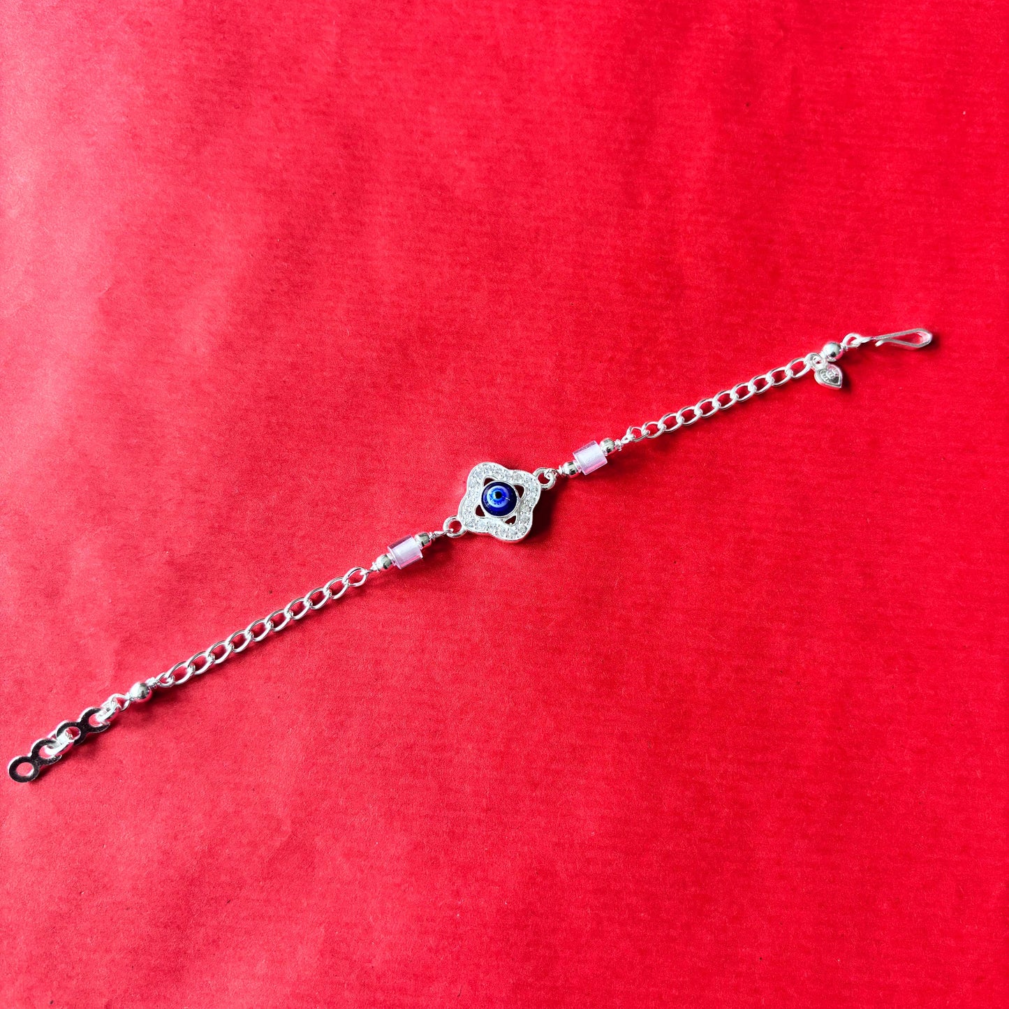 Rakhi- Silver rakhi with evil eye