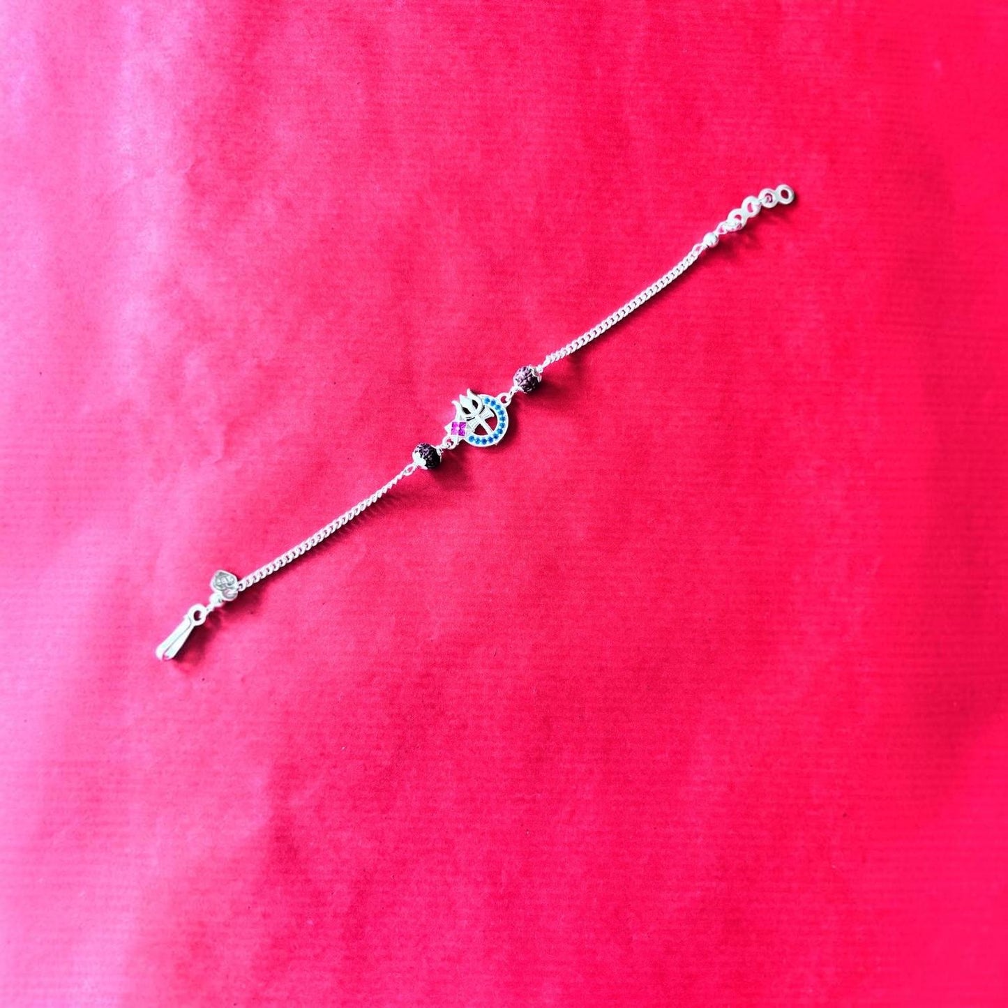 Rakhi- Silver rakhi with Trident & Rudraksha